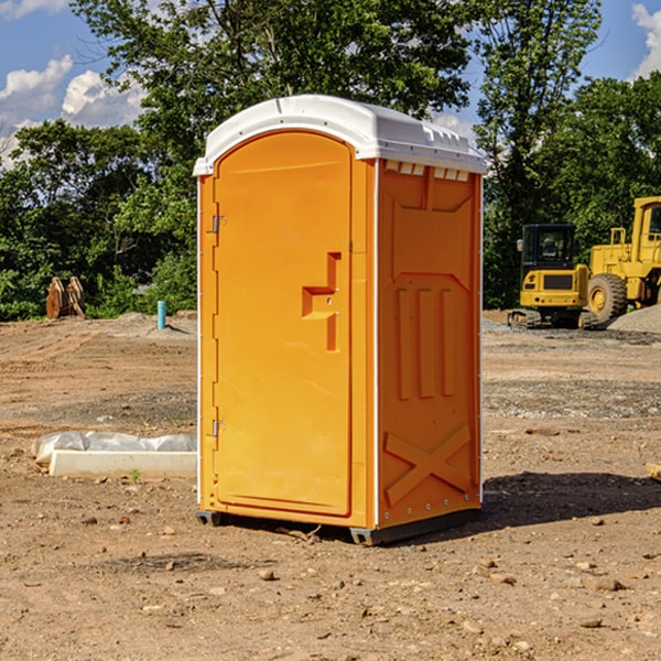 what is the cost difference between standard and deluxe portable toilet rentals in South Byron